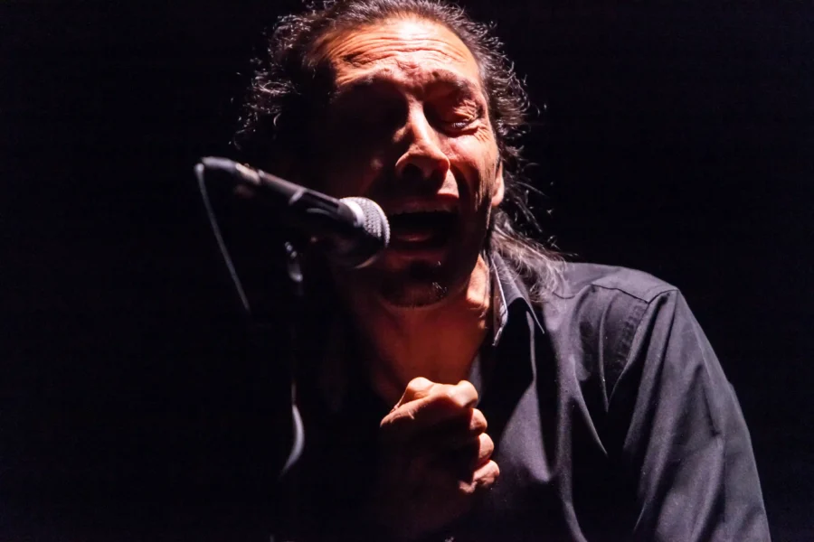 The singer Antonio el Ciervo performing a soleá with his fist to his chest during a flamenco show at Cardamomo, Madrid